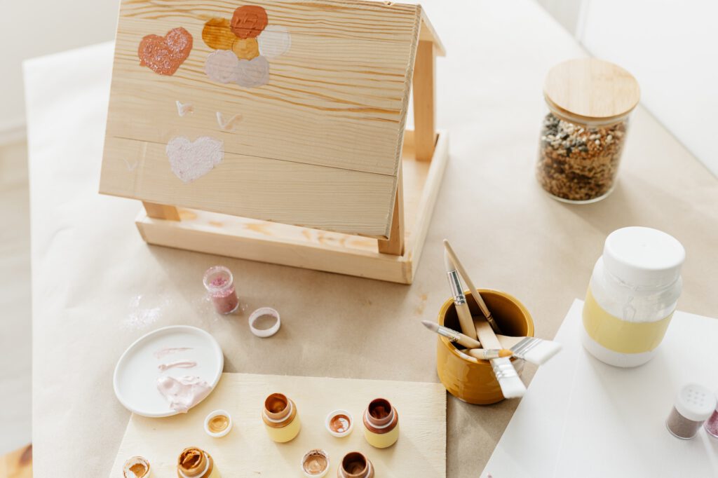 Wooden bird feeder, winter bird care and children's creativity at home